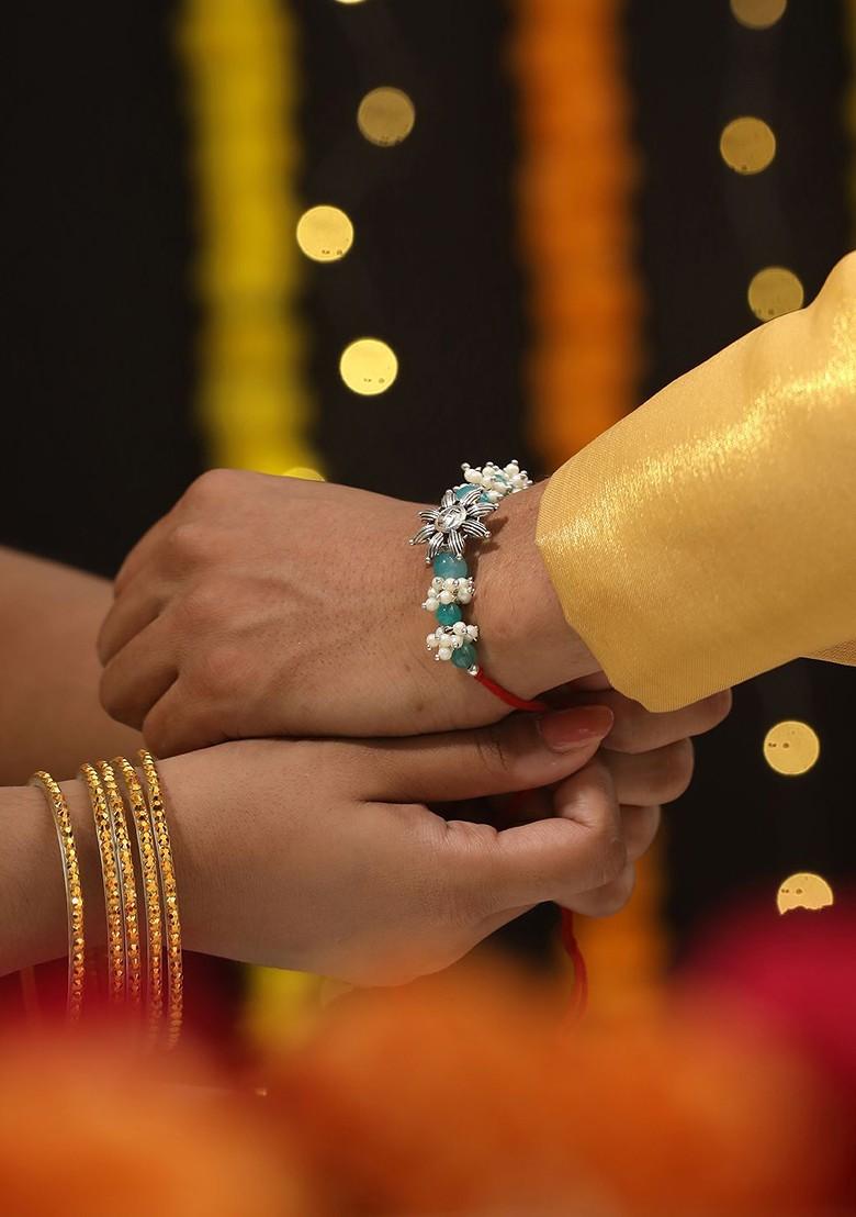 Swastik Motif And Mogra Beaded Bhaiya Bhabhi Rakhi With Roli And Chawal