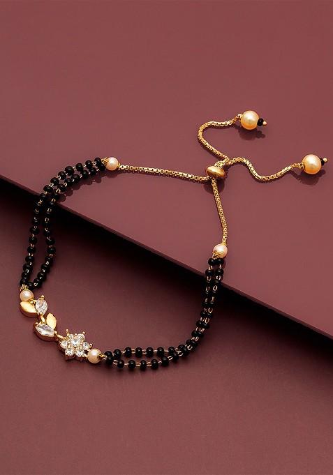 Women Gold Plated And Black Brass American Diamond Hand Mangalsutra Link Bracelet