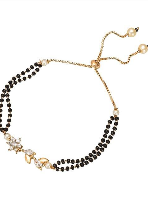 Women Gold Plated And Black Brass American Diamond Hand Mangalsutra Link Bracelet