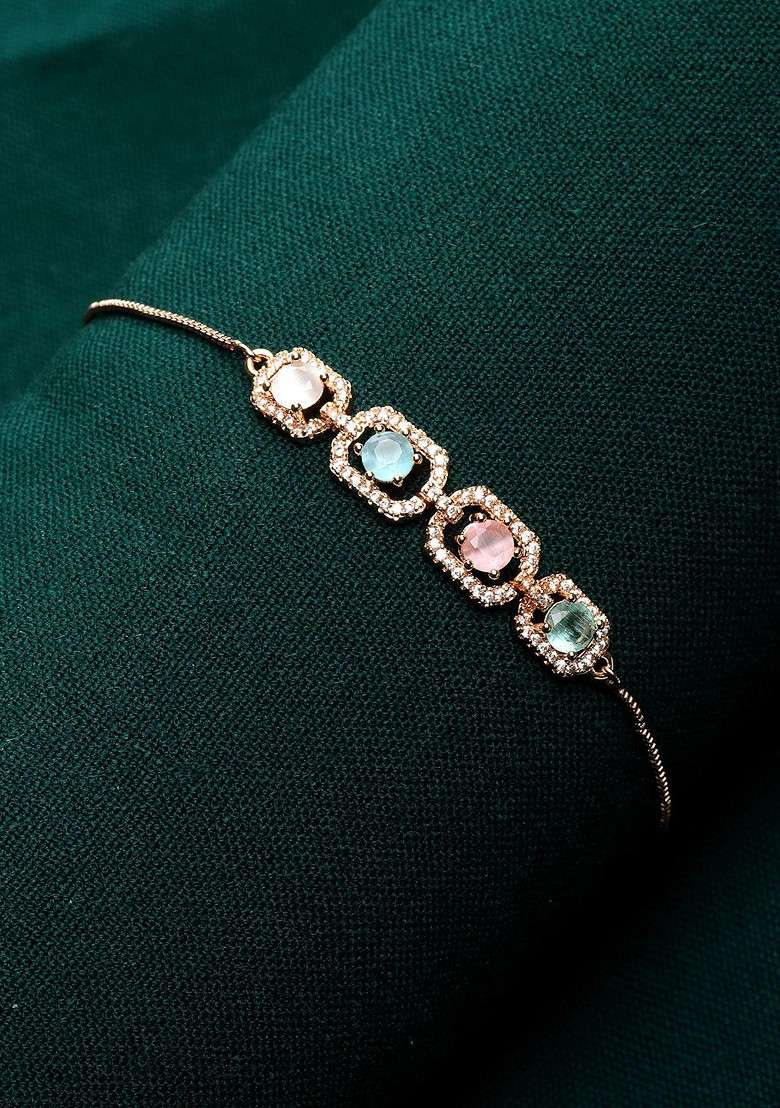Gold Plated Ad Pink And Blue Stone Studded Handcrafted Charm Bracelet - Indya