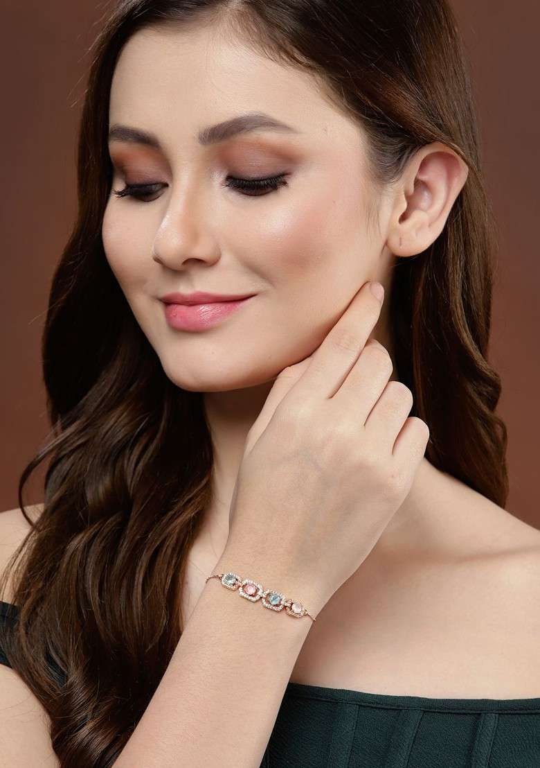Gold Plated Ad Pink And Blue Stone Studded Handcrafted Charm Bracelet - Indya