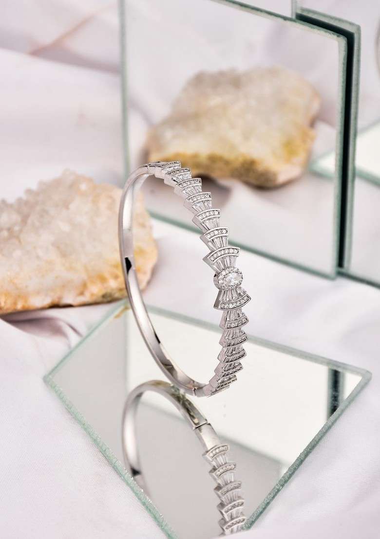 Rhodium Plated American Diamond Studded Bow Shaped Openable Bangle Style Bracelet - Indya