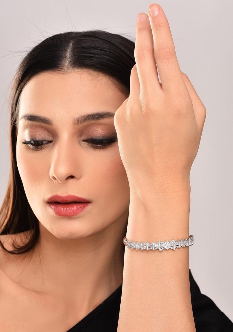 Rhodium Plated American Diamond Studded Bow Shaped Openable Bangle Style Bracelet