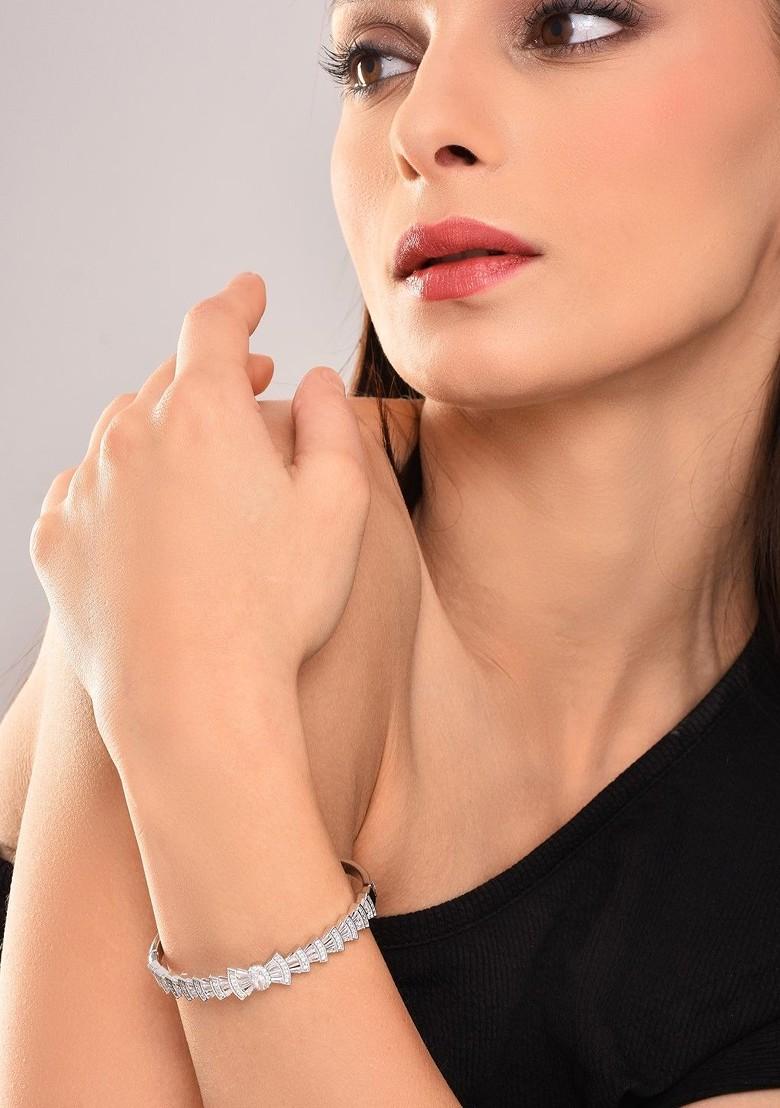 Rhodium Plated American Diamond Studded Bow Shaped Openable Bangle Style Bracelet