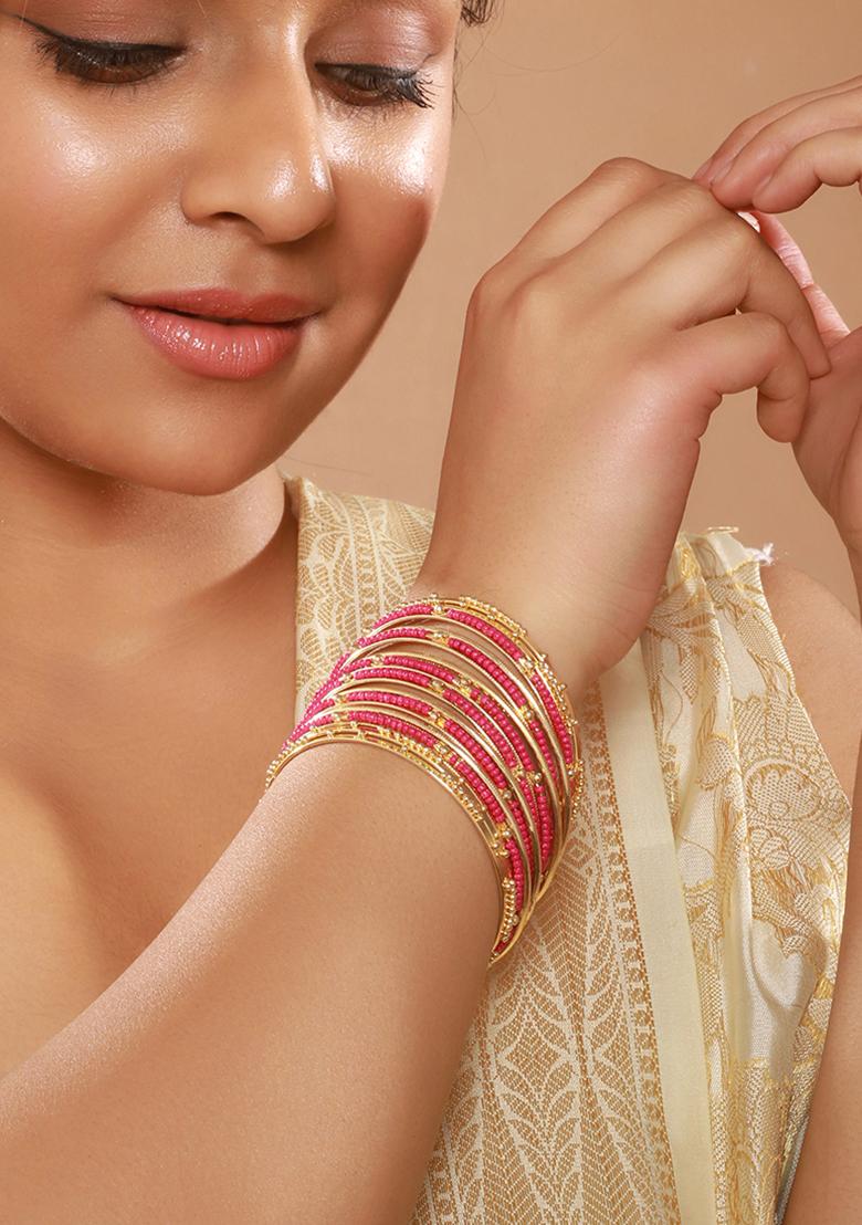 Set Of 12 Gold Plated Stone Studded And Beaded Bangles