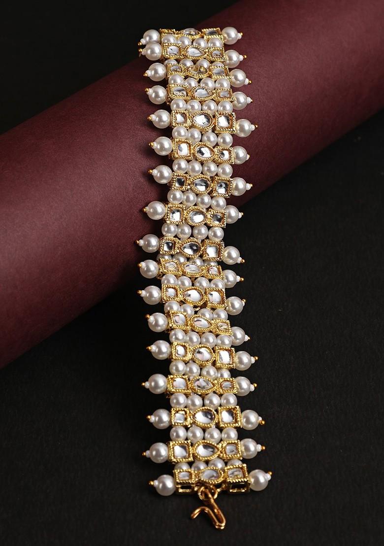 Women Gold Toned And White Pearl And Stone Studded Wraparound Bracelet