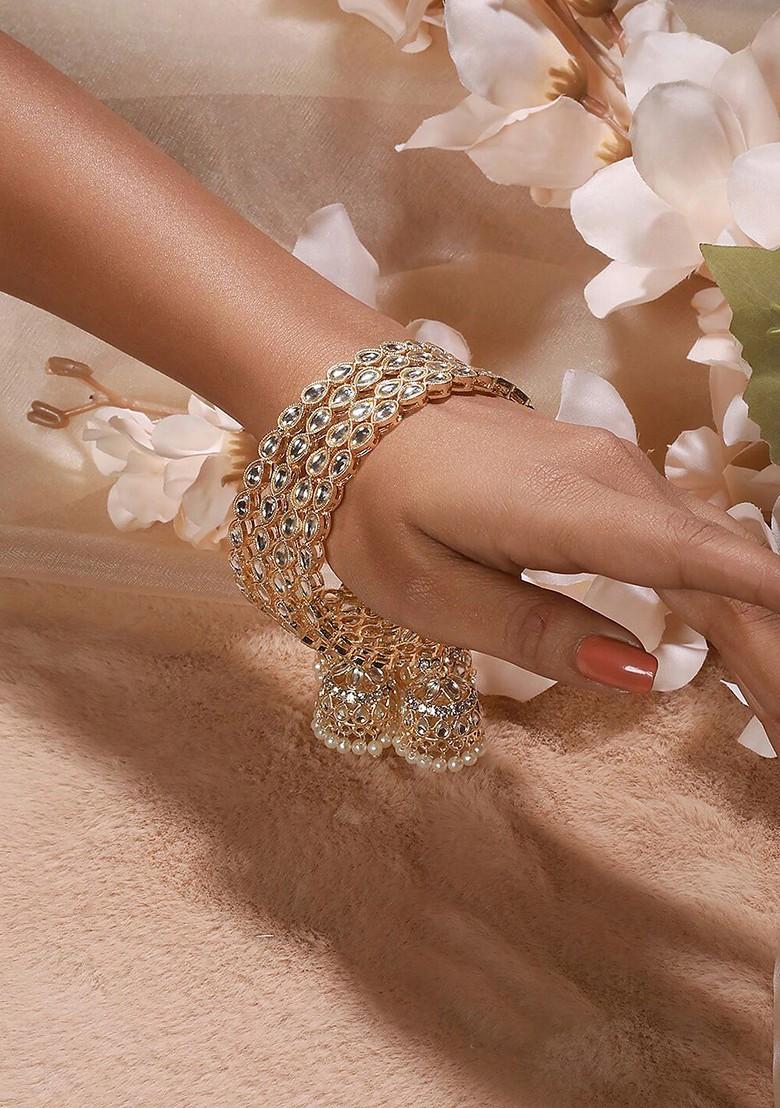 Set Of 4 Gold Plated Kundan Studded And Pearls Beaded Bangles