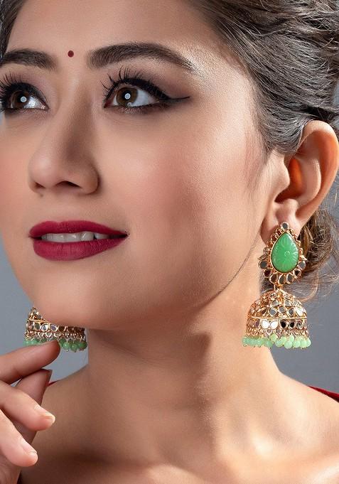 Gold Toned And Green Dome Shaped Jhumkas Earrings
