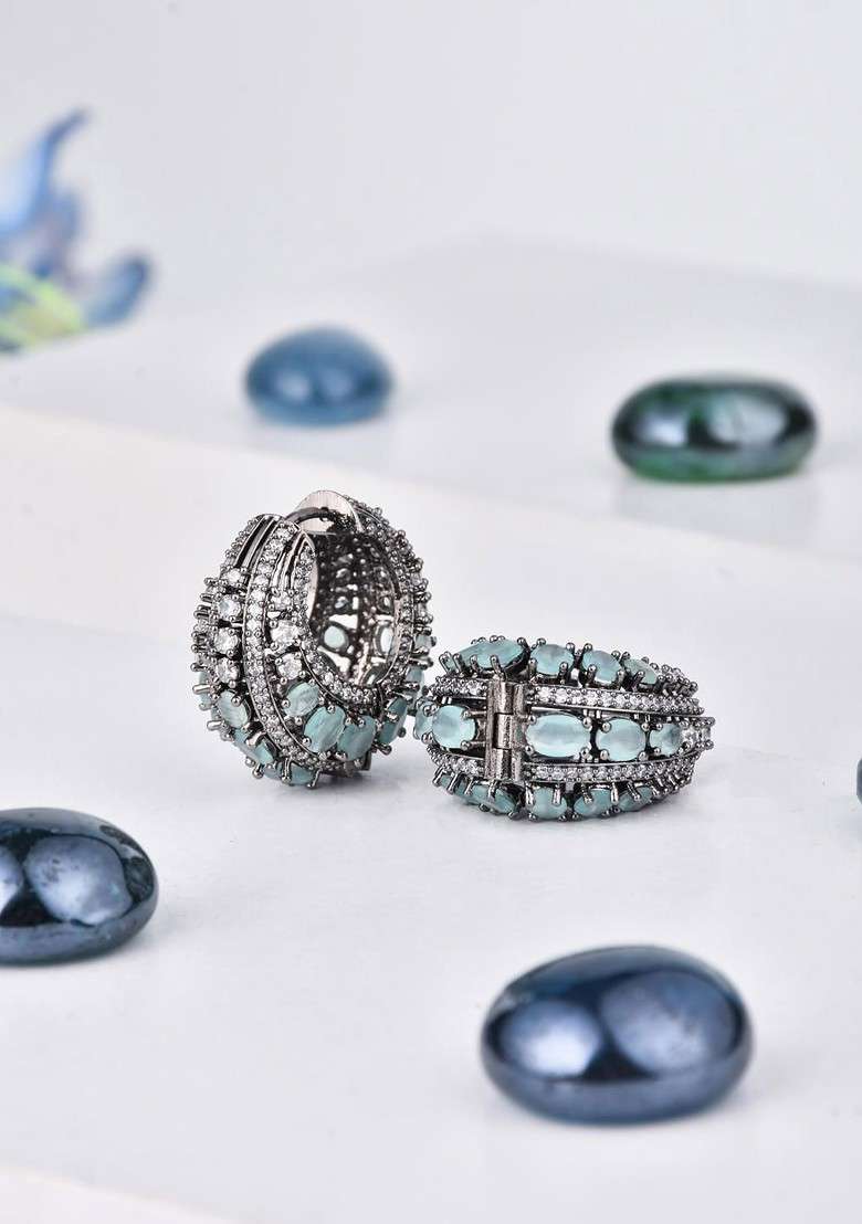 Sea Green Rhodium Plated Rhodium Plated Cubic Zirconia Studded Oval Shaped Hoop Earrings - Indya