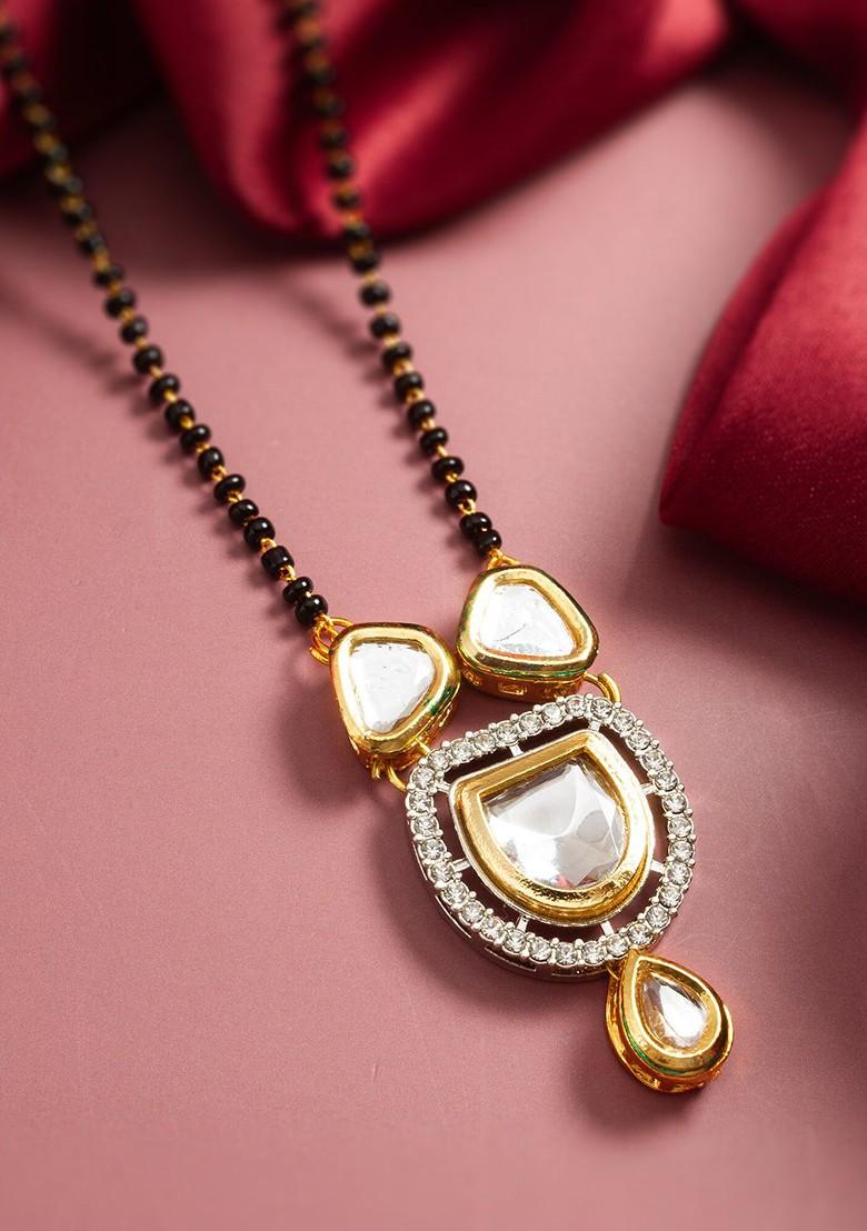 Gold Plated Floral Shaped Kundan Studded And Pearls Beaded Mangalsutra