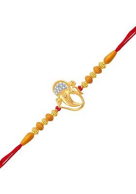 Gold And Rhodium Plated Cz Studded With Omkara Ganesh Charm Rakhi For Women