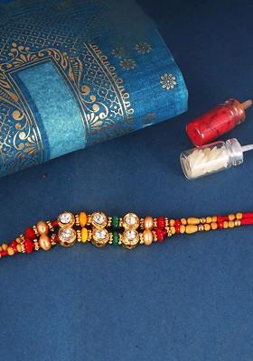 Red Gold And Rhodium Plated Cubic Zirconia Studded Thread Rakhi For Women