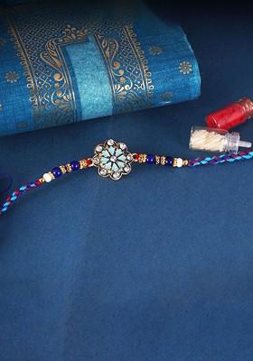 Blue Gold And Rhodium Plated Flower Thread Rakhi With Roli Chawal For Women