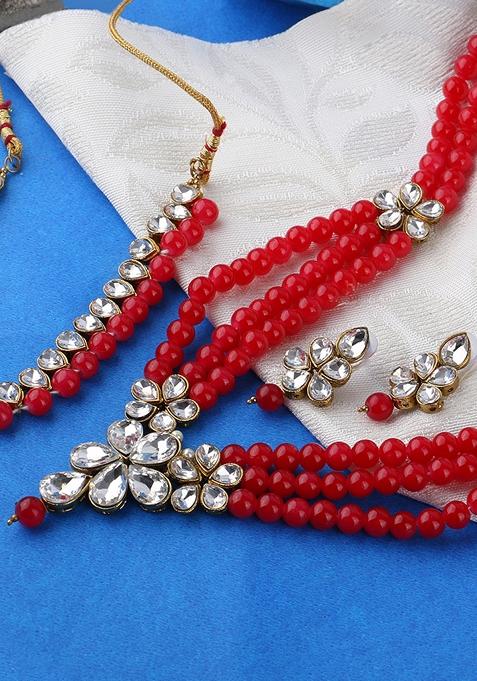 Gold Plated Red And White Kundan Studded And Beaded Multi Stranded Jadau Jewellery Set