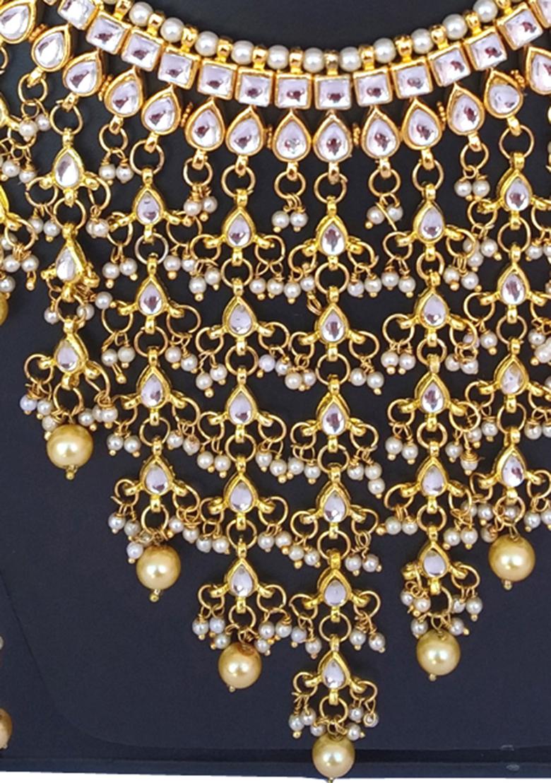 Golden And Cream Kundan Stone Work Alloy Necklace Set