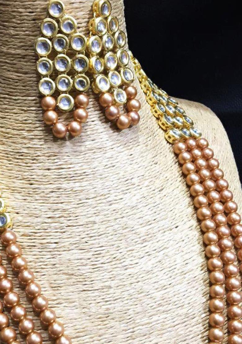 Golden And Cream Kundan Stone Work Alloy Necklace Set
