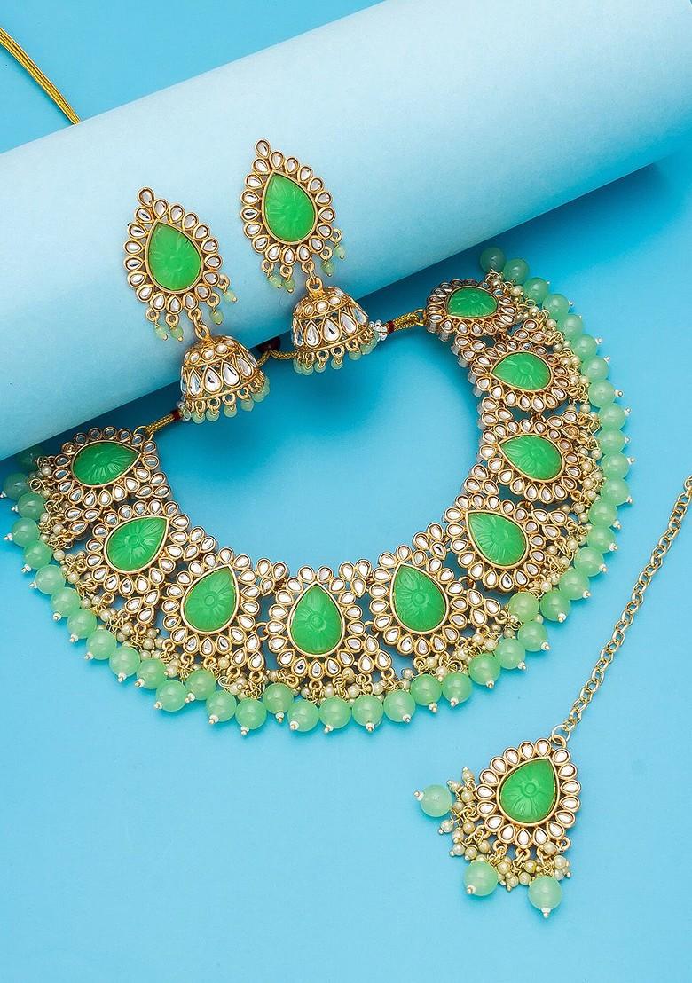 Gold Plated And Green Stone Studded And Pearl Beaded Jewellery Set