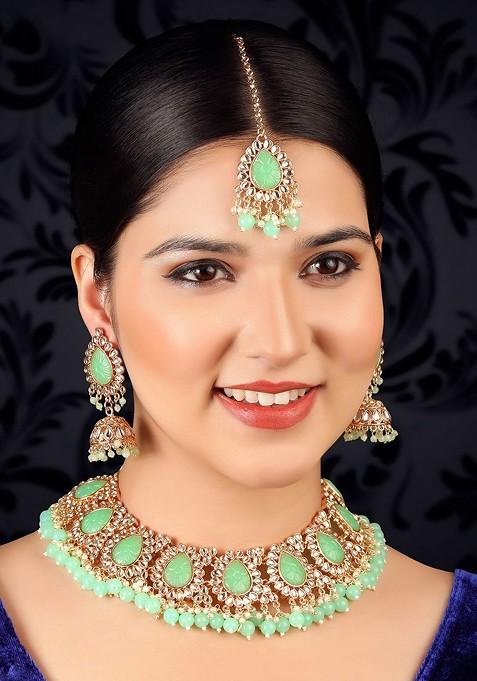 Gold Plated And Green Stone Studded And Pearl Beaded Jewellery Set