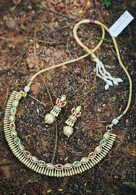 Gold Plated Red And Green Kundan Studded And White Beaded Handcrafted Jewellery Set