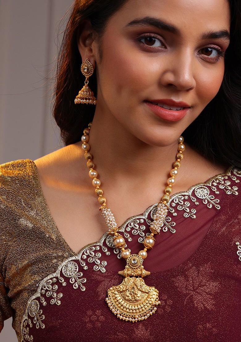 Gold Plated Stones Studded And Beaded Necklace And Earrings