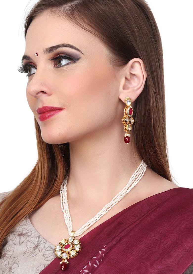 Gold Plated Stones Studded And Beaded Necklace And Earrings