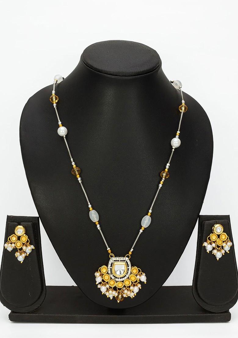 Silver Kundan Studded And Beaded Necklace And Earrings