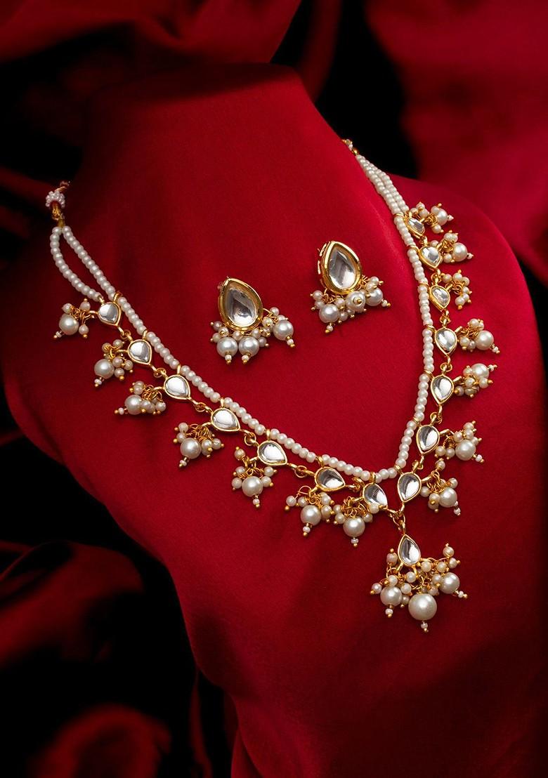 Kundan Studded And Beaded Necklace And Earrings