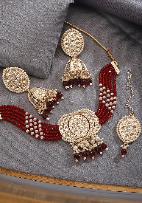 Gold Plated Kundan Studded And Beaded Maroon Necklace And Earrings Set With Maangtikka