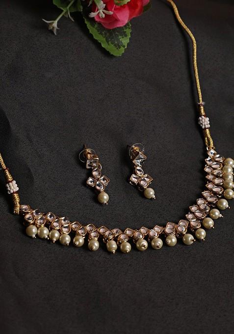 Gold Plated White Kundan Studded And Beaded Jewellery Set