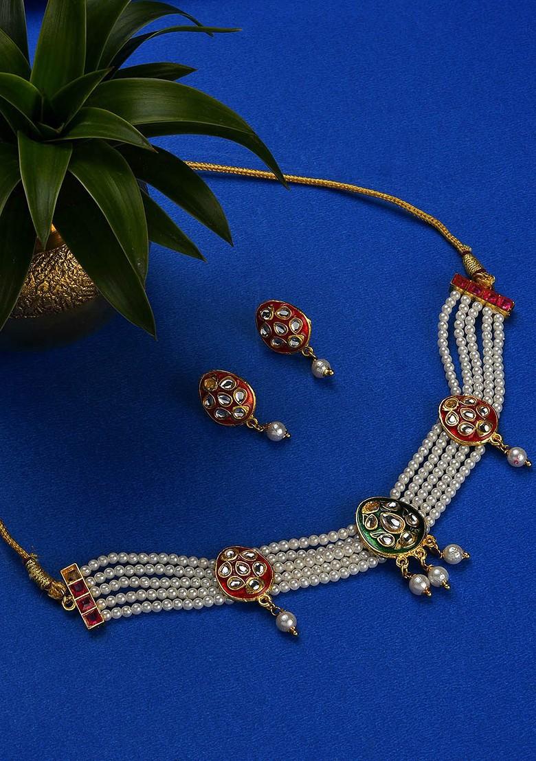Gold Plated White And Red Kundan Studded Jewellery Set