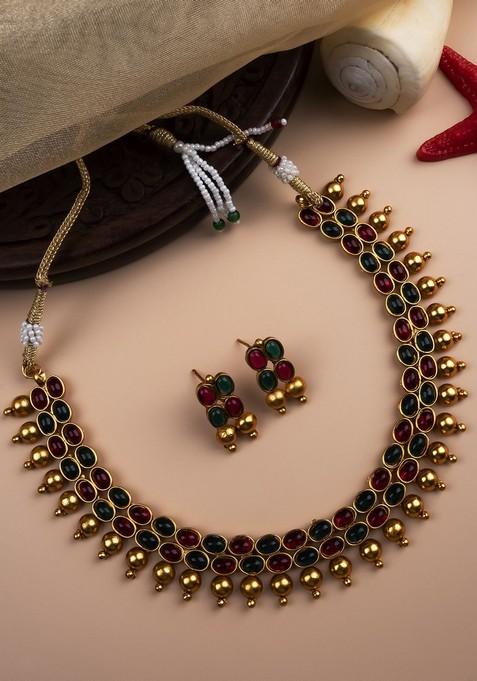 Gold Plated Ruby Studded And Beaded Jewellery Set