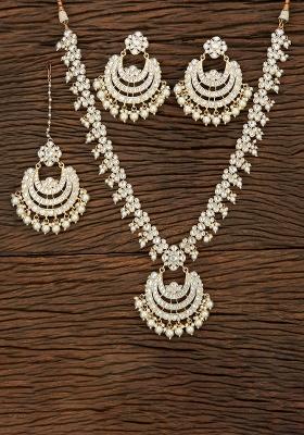 Golden White Designer Brass Kundan Necklace With Earring And Tika Set