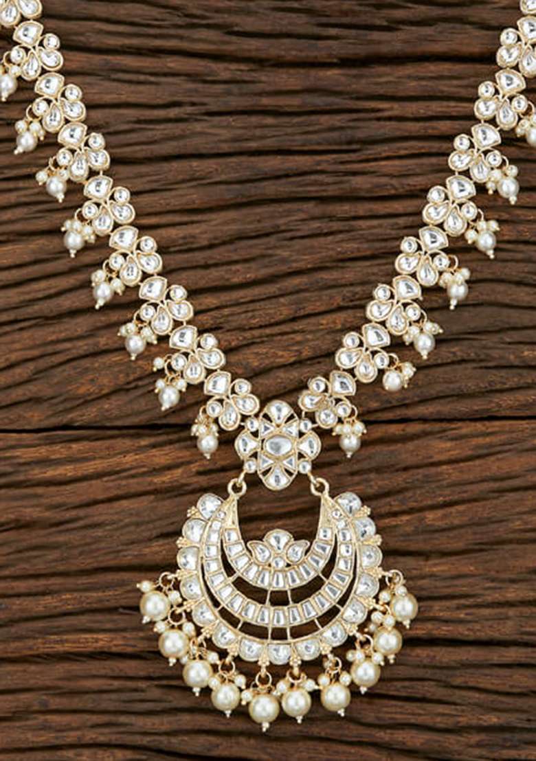 Golden White Designer Brass Kundan Necklace With Earring And Tika Set - Indya