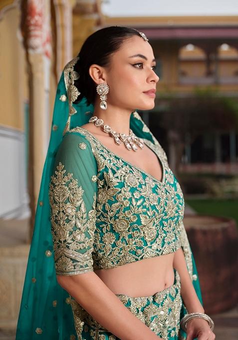 Teal Green Zari Thread Embroidered Net Lehenga Set