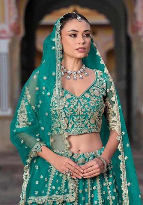 Teal Green Zari Thread Embroidered Net Lehenga Set