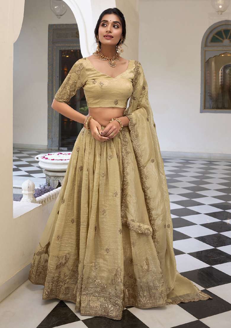 Cream Sequence Embroidered Gold Cursh Lehenga Set With Dupatta for Diwali and Festive Wear - Indya