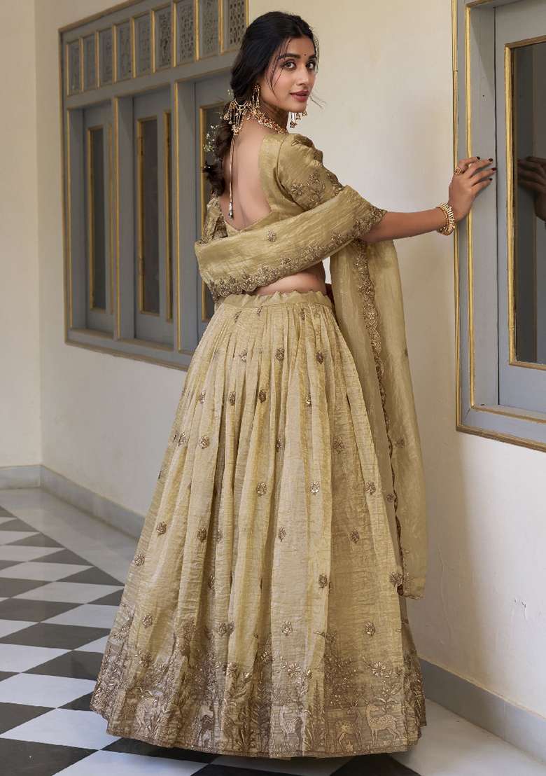 Cream Sequence Embroidered Gold Cursh Lehenga Set With Dupatta for Diwali and Festive Wear - Indya
