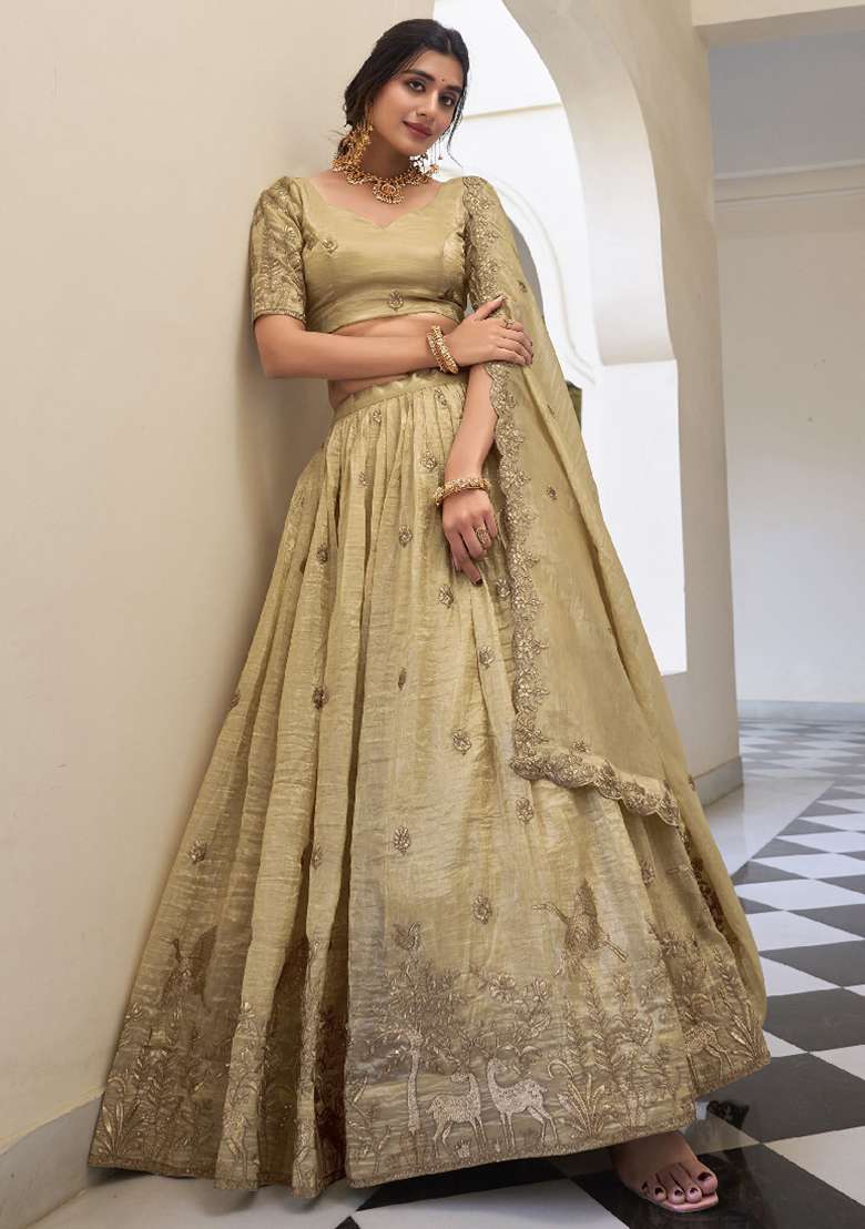 Cream Sequence Embroidered Gold Cursh Lehenga Set With Dupatta for Diwali and Festive Wear - Indya