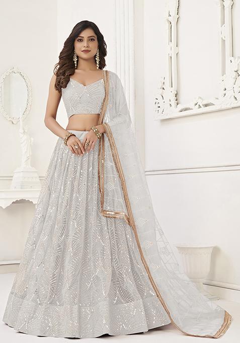 White Embroidered Net Lehenga Set — view on Indya