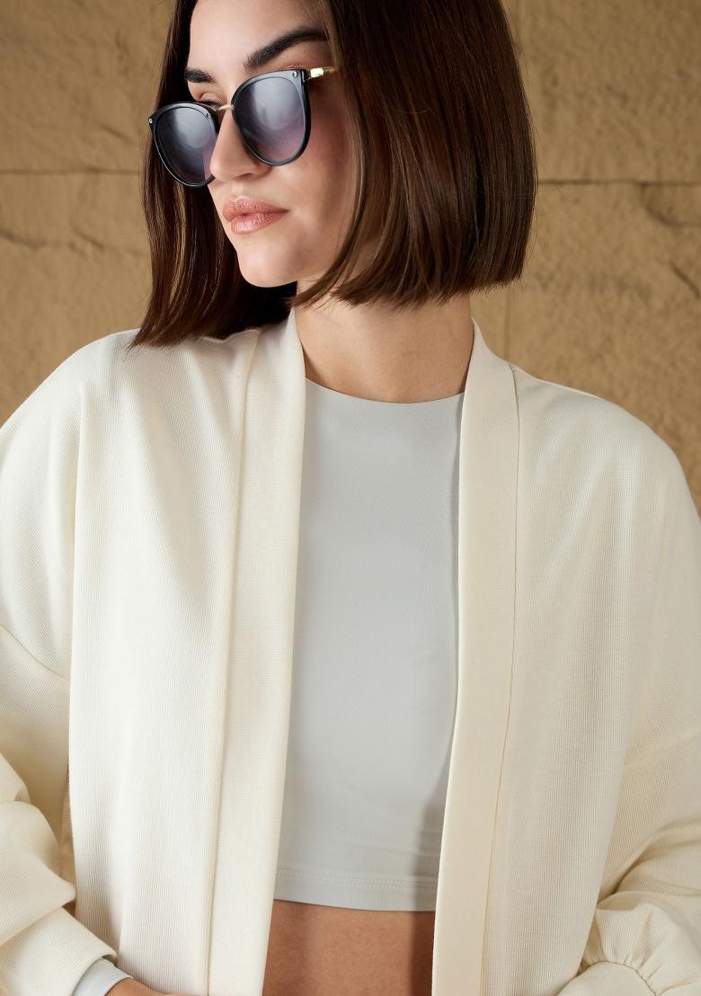 Off White Soild Rib Shrug - Indya