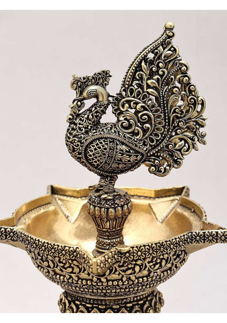 Superfine Peacock Brass Oil Wick Diya Pair with Intricate Carvings Set of 2 - Indya