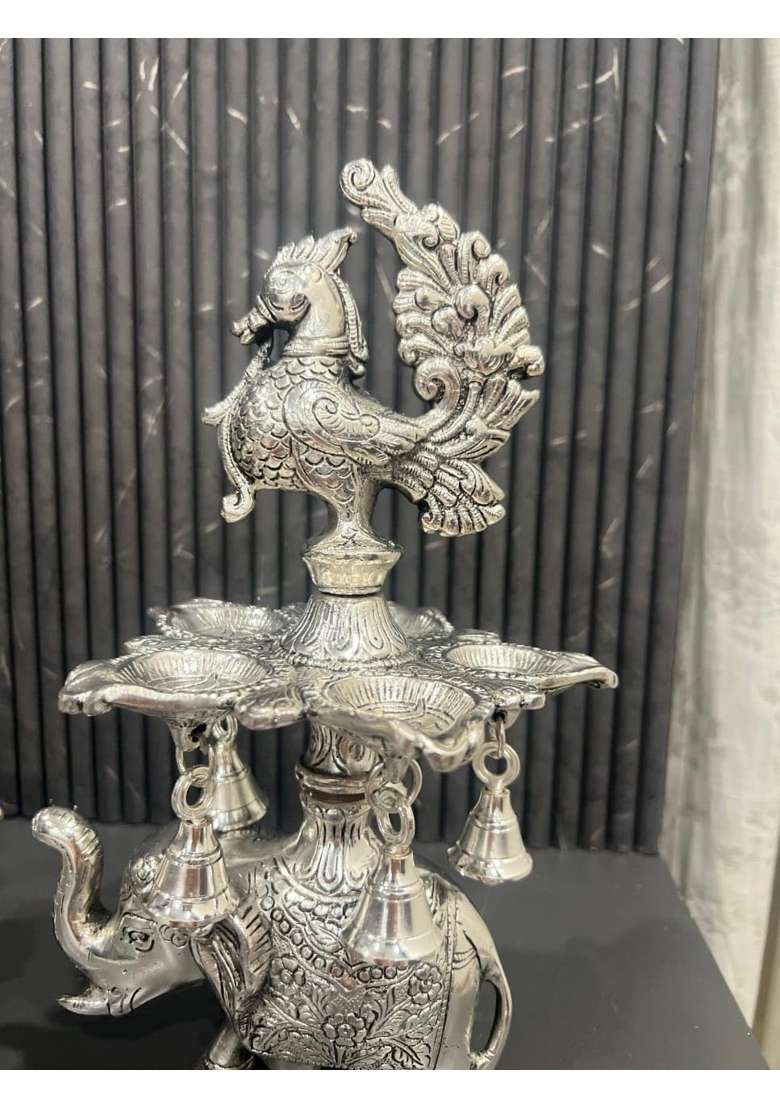 Mishita Collections German Silver Peacock Samai Pair Diya Stand with Elephant Base and Plate Pack of 2 - Indya