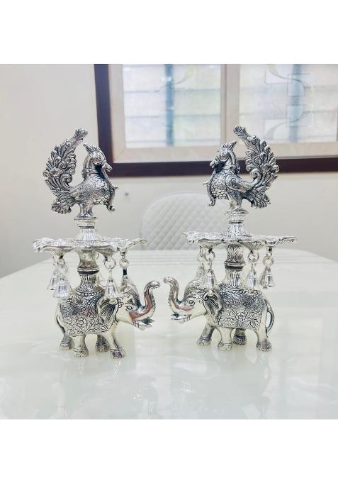 Mishita Collections German Silver Peacock Samai Pair Diya Stand with Elephant Base and Plate Pack of 2