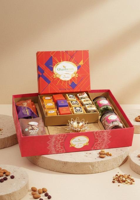 Ghasitaram Orange Hamper Box With Best Bites, Crunchy Cashew, Flavour Raisins, And Diya