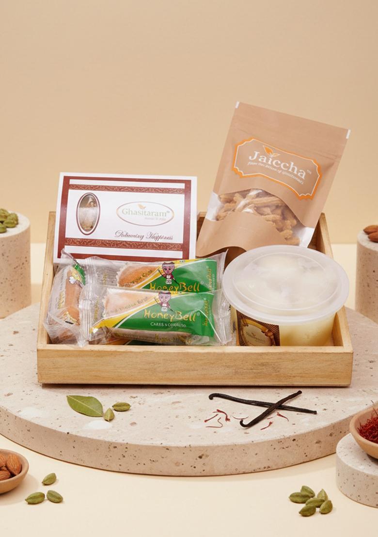 Ghasitaram Holi Sweets| Hampers| Gifts-Wooden Basket Of Gujiyas, Butter Chakli, Rasgulla And Cake