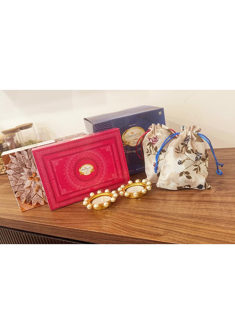 Ghasitaram Diwali Gifts-Blue Box Of Kaju Katli, Milk Cake, Almonds And Flavour Raisins In Jute Pouch...