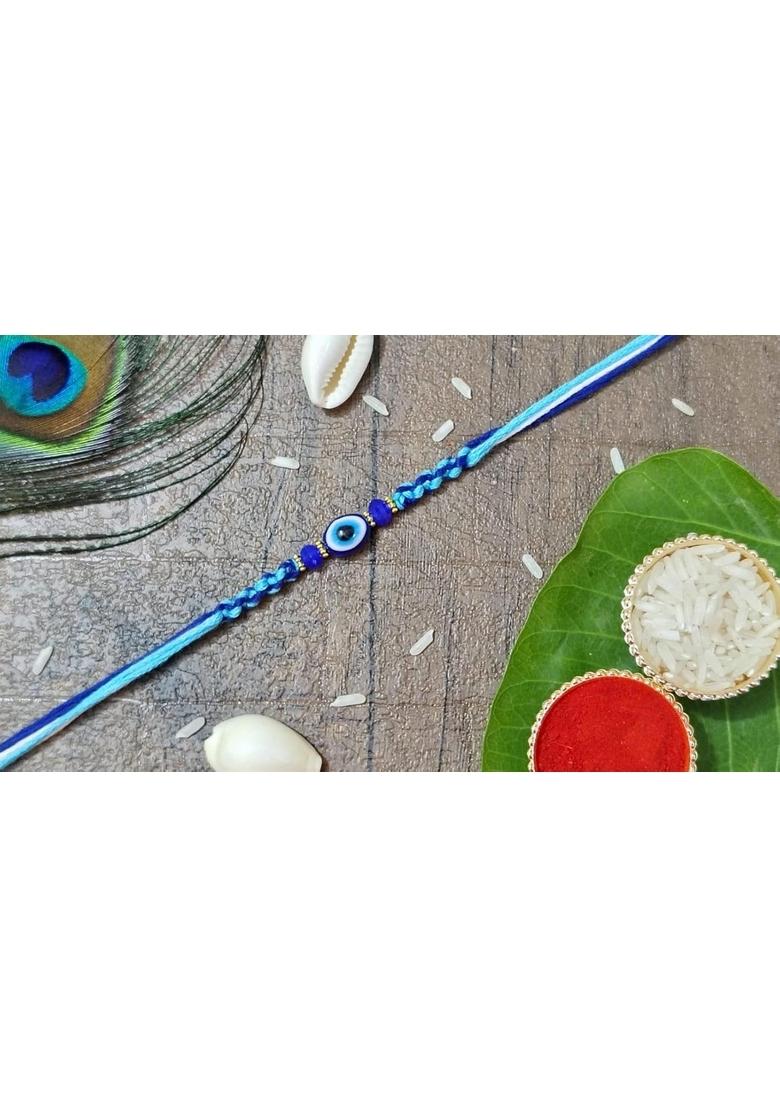 Yuvraj Evil eyes design rakhi for brother & sweets Chocolate soan papdi 200 gm box with roli chawal pack