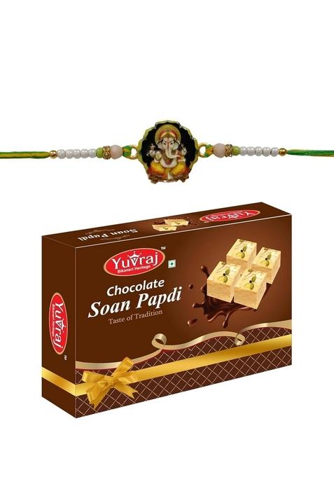 Yuvraj Ganesha design rakhi for brother & sweets Chocolate soan papdi 200 gm box with roli chawal pack