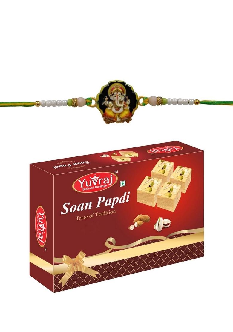 Yuvraj Ganesha design rakhi for brother & sweets soan papdi 200 gm box with roli chawal pack