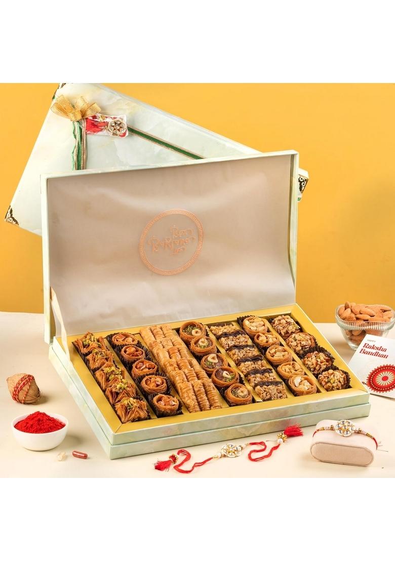THE BAKLAVA BOX Royal Vega Gift Assorted Premium Baklavas With 2 Sets of Rakhi, Ribbon Packaging and Greeting Card (1 Kg)